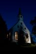 Small white church in evening