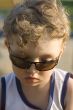 Boy in sun glasses closeup