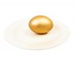 golden egg at plate