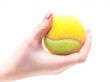 tennis ball in hand