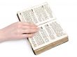 woman hand on old book