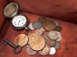 Old clock, key and coins