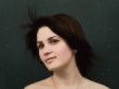 woman behind wet glass