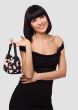 Smiling young woman with handbag