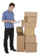 Man with marker and pile cardboard boxes