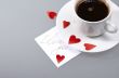 Cup with hot coffee, hearts and a note
