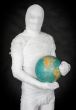 Man in costume mummy and terrestrial globe