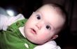 Infant looks at something with astonishment