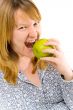 young woman eating apple