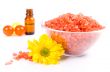 bath salt, oil balls in a bowl and flower