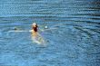 single female figure in wide water surface