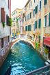 Canal in Venice and Restaurant
