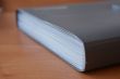 Grey folder on the wooden table