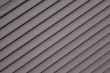 Grey striped diagonal background like a jalousie