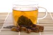 white tea, nylon tea-bag and golden sugar