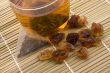 white tea, nylon tea-bag and golden sugar