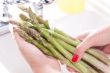 Woman Washing Asparagus