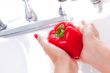Woman Washing Red Bell Pepper
