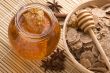 fresh honey with honeycomb, spices and breakfast flakes