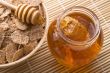 fresh honey with honeycomb and breakfast flakes