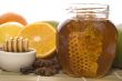 fresh honey with honeycomb, spices and fruits