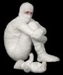 Egyptian mummy emo sitting on a black