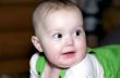 Infant looks at something with interest