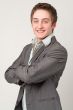 young businessman with arms across