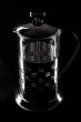 French-press in black background