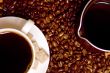 coffee, caffee-maker over beans background