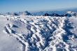 Deep footprints on the snow in the mountains