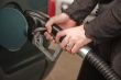 Woman Pumping Gasoline