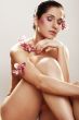 Beautiful young woman with orchid flowers