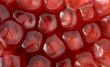 Red grains of pomegranate background