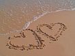Hearts drawn on sand