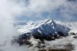 Peak surrounded by clouds. Swiss Alps