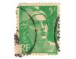Old green french stamp with woman head