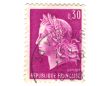 Old purple french stamp with woman head