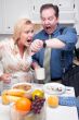Stressed Couple in Kitchen Late for Work