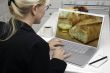 Woman In Kitchen Using Laptop - Food and Recipes