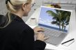Woman In Kitchen Using Laptop - Vacation