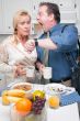 Stressed Couple in Kitchen Late for Work