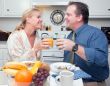 Happy Attractive Couple In Kitchen