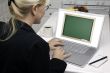 Woman In Kitchen Using Laptop - Chalkbaord