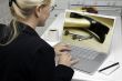 Woman In Kitchen Using Laptop - Home Improvement