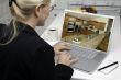 Woman In Kitchen Using Laptop - Home Improvement