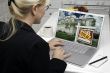 Woman In Kitchen Using Laptop for Real Estate