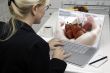 Woman In Kitchen Using Laptop - Food and Recipes