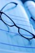 glasses on newspaper page