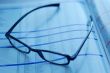 glasses on newspaper page